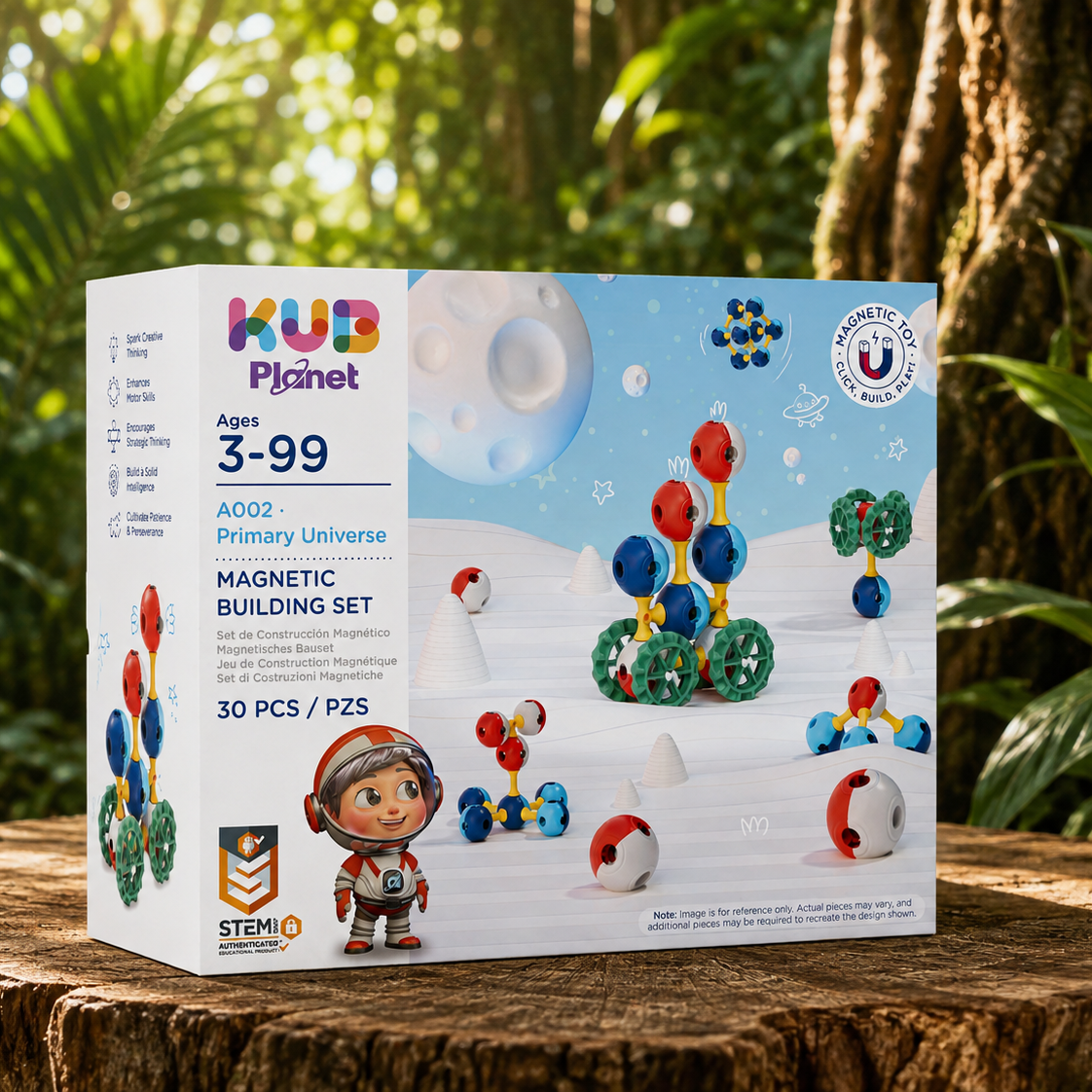 KUB Planet A002 Primary Universe Magnetic Building Set box, displayed on a rustic tree stump with a lush green forest background. The packaging is white with colorful graphics depicting space-themed structures and a cartoon astronaut.